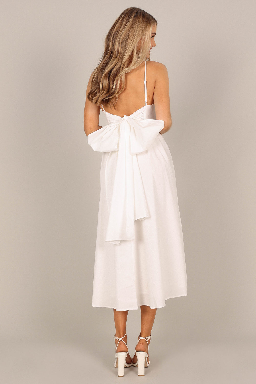 white dress with bow in back